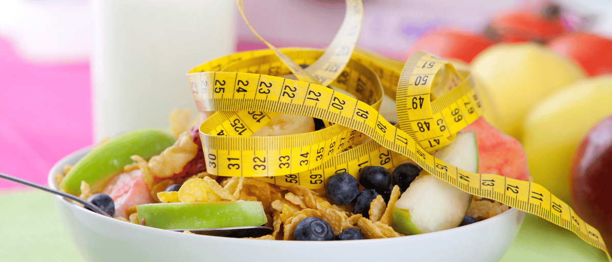 plate of mixed vegetables and measuring tape